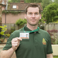 OFTEC registered heating technician showing ID badge